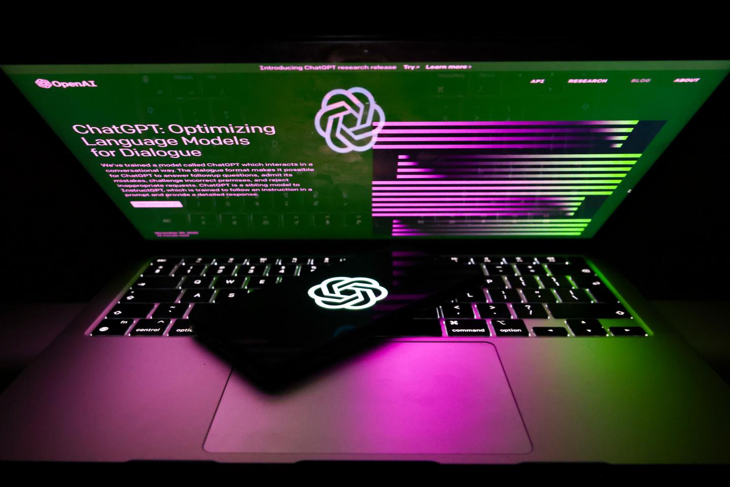 ChatGPT and OpenAI emblem and website are screened for illustration