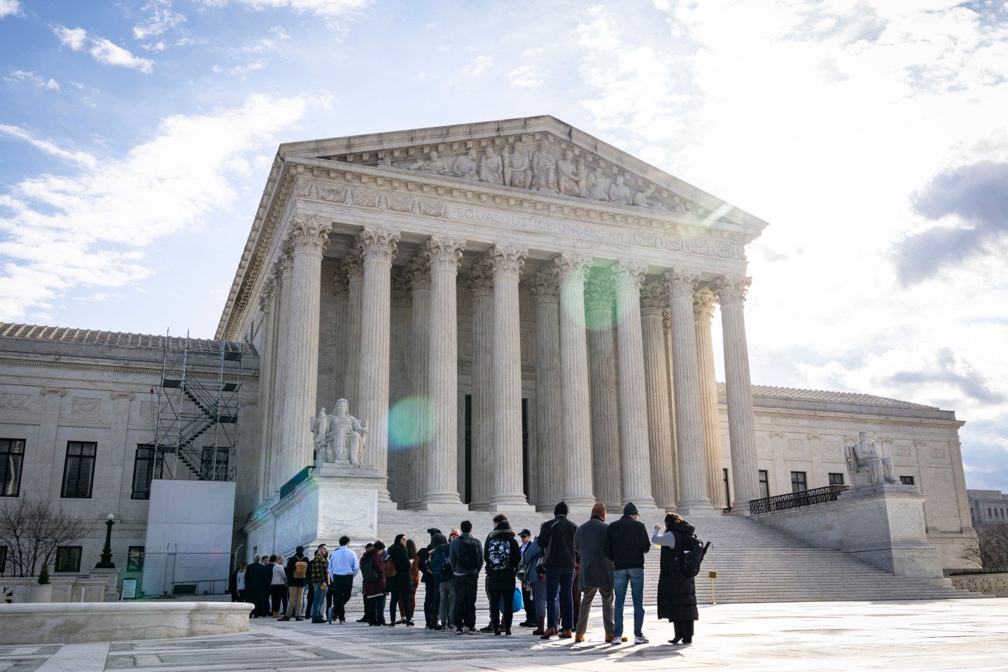 People wait in line to listen to oral arguments at the U.S. Supreme Court on February 21, 2023 in Washington, DC. Oral arguments are taking place