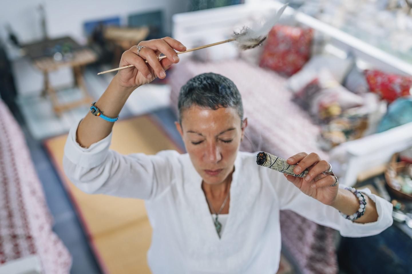 Woman burning sage