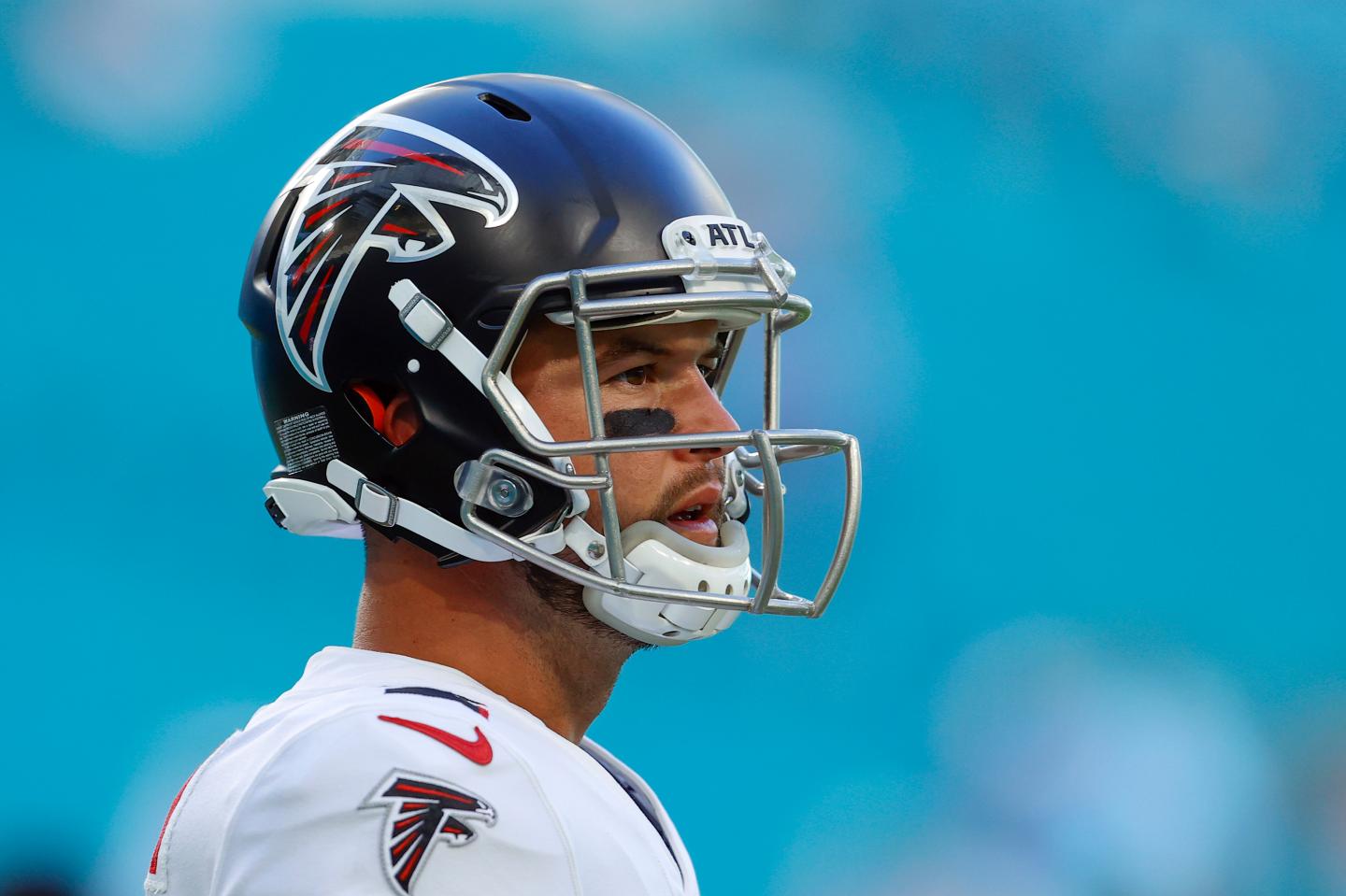 AJ McCarron in Atlanta Falcons kit watching a game