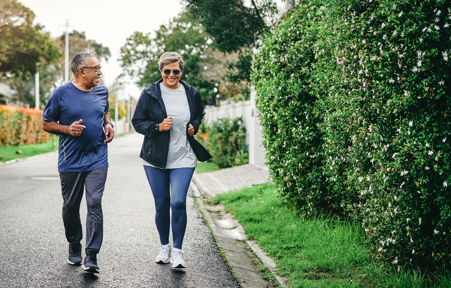 Full length shot of a senior couple bonding together while running outdoors