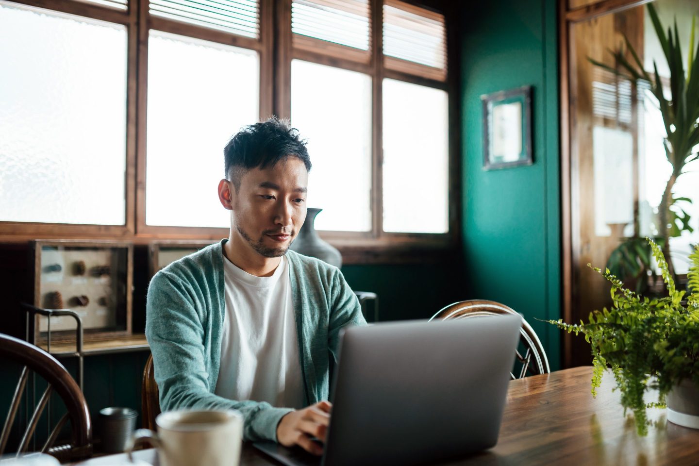 Young man working on laptop from home