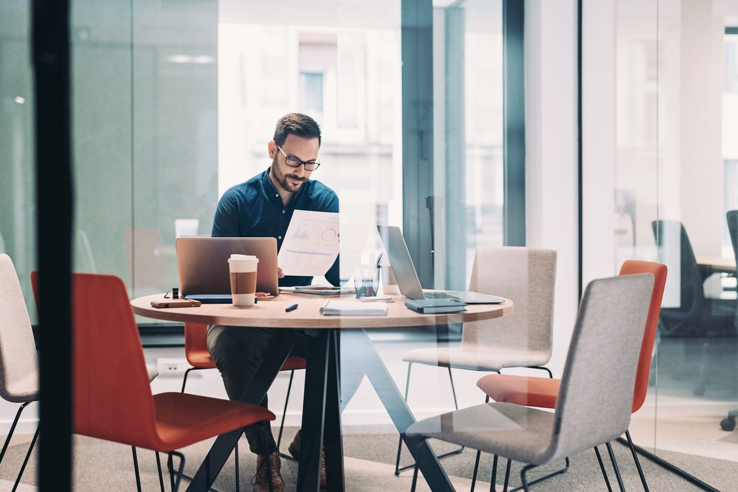Businessman working alone in a glass office