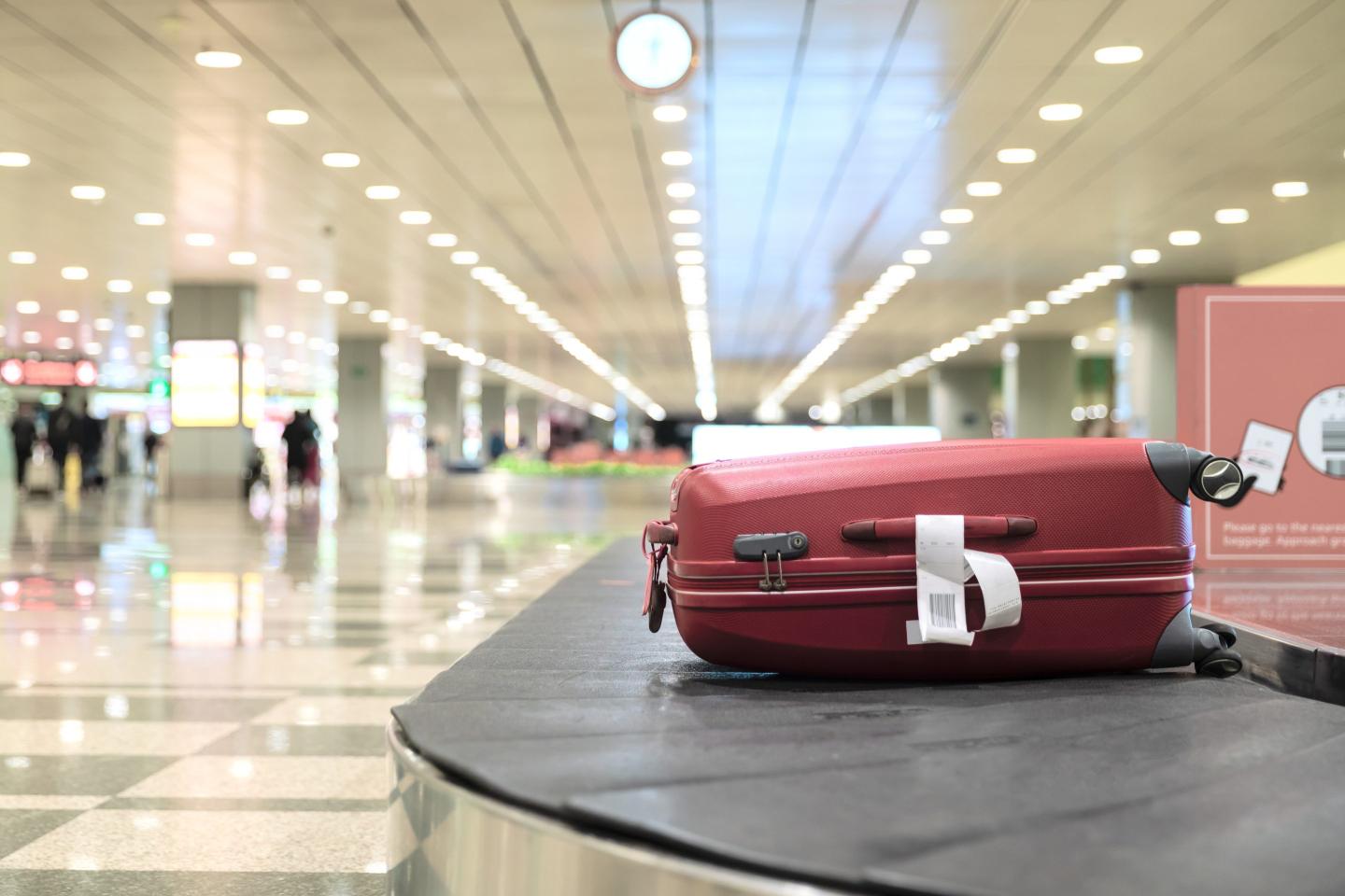 Luggage On Conveyor Belt At Airport