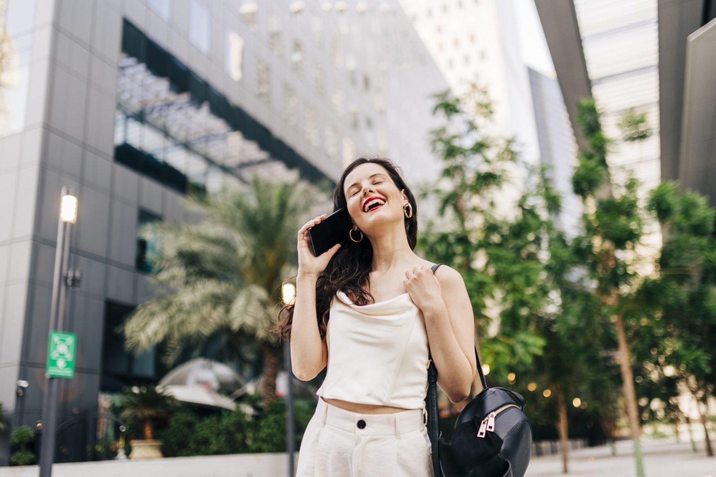 Woman using her smartphone on the street