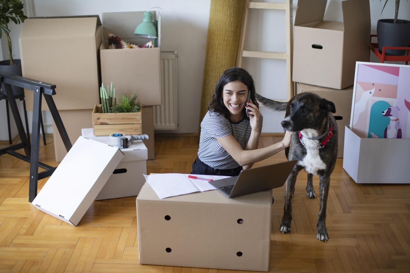 A young woman setting up a new house