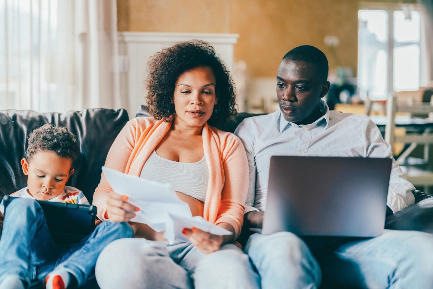 Two people looking over bills