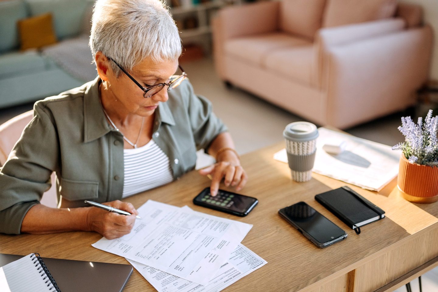 Senior woman doing finances at home