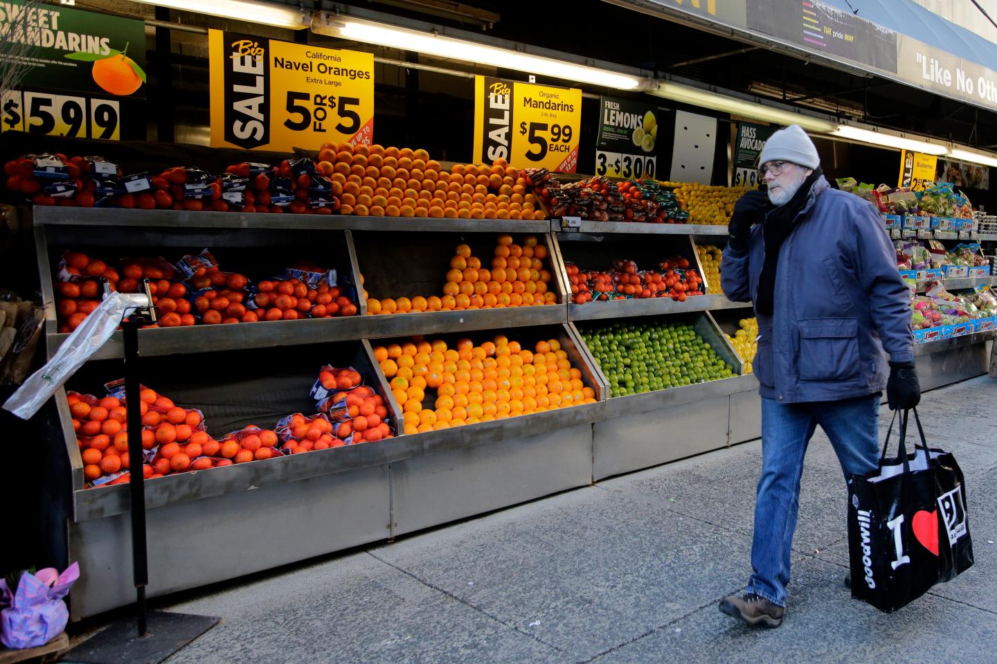 A man walks past a grocery store on February 01, 2023 in New York City.