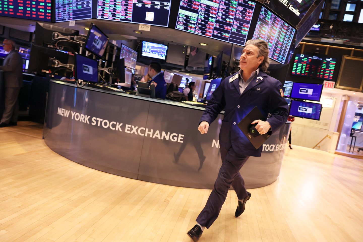 Traders work the floor of the New York Stock Exchange (NYSE) during morning trading on Friday.
