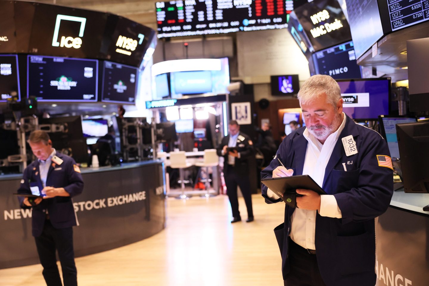 Traders work on the floor of the New York Stock Exchange.