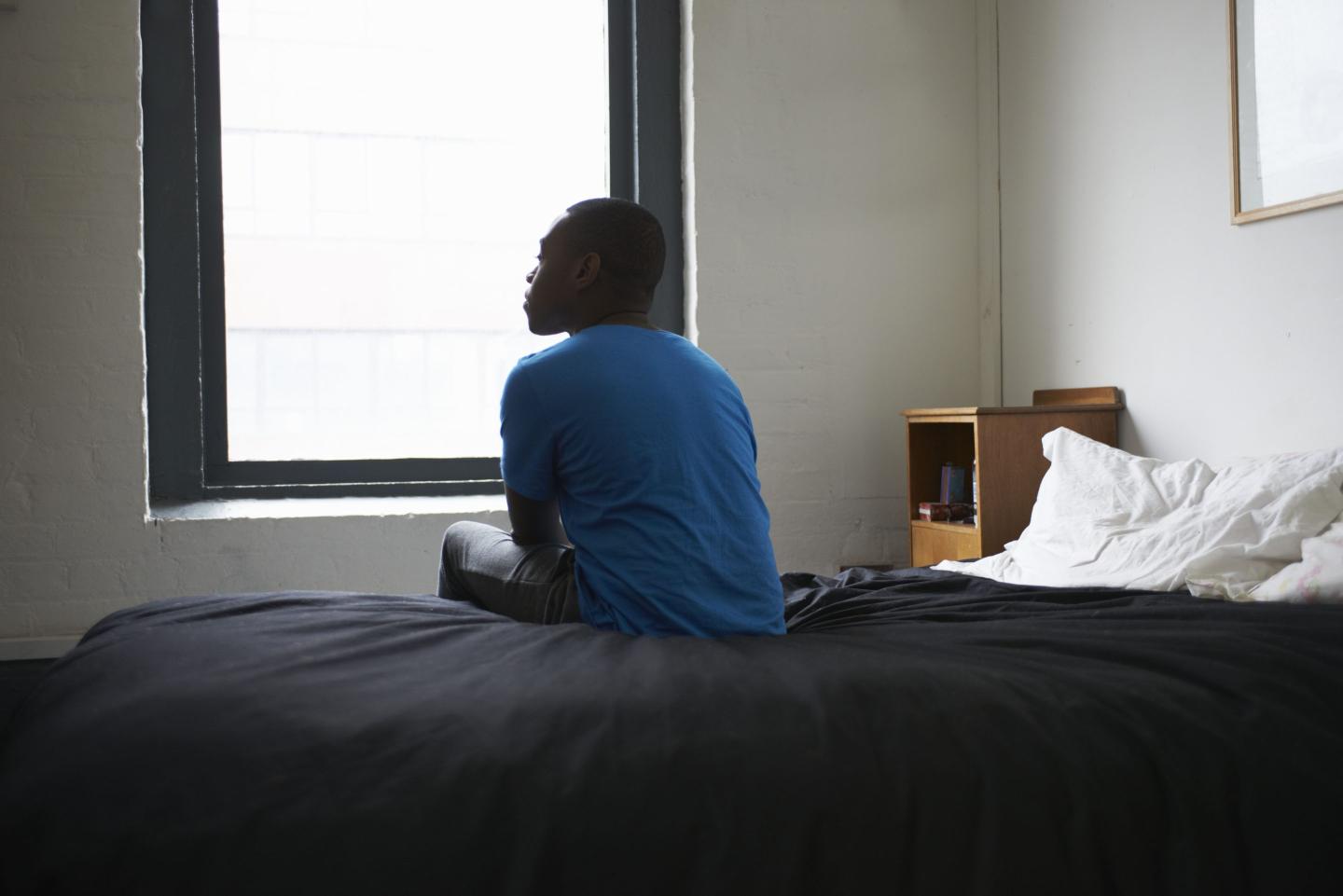 Man sitting on bed