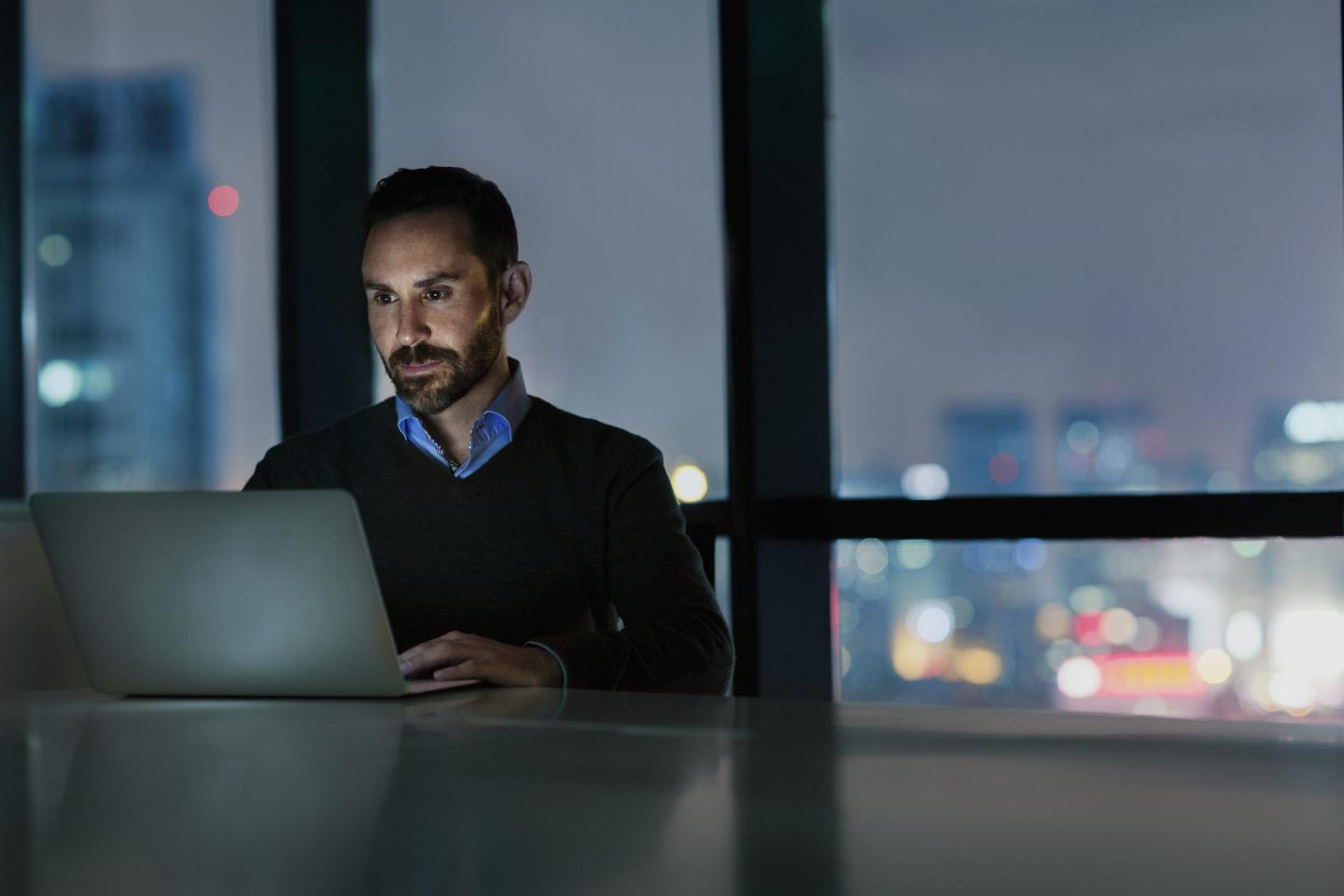man at laptop at night