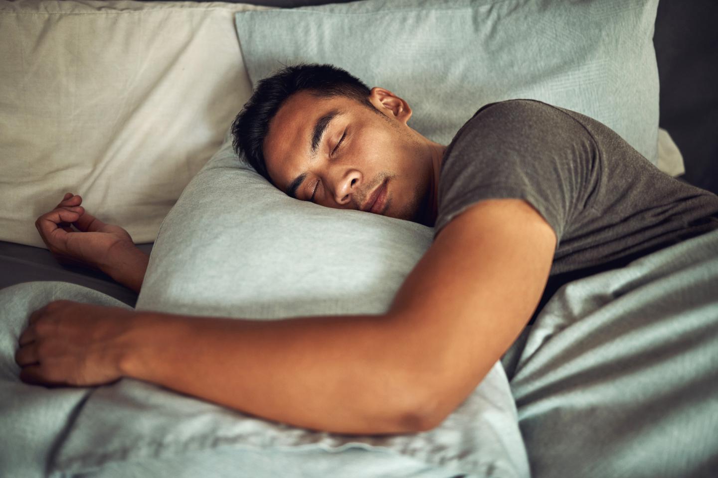 Man sleeping in bed.