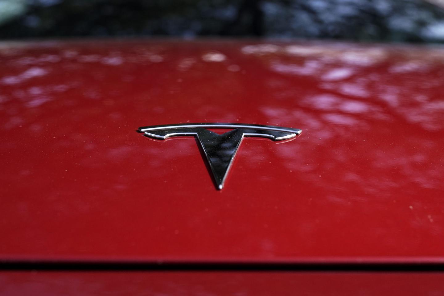 Tesla says it will halve the cost of its next generation of EVs