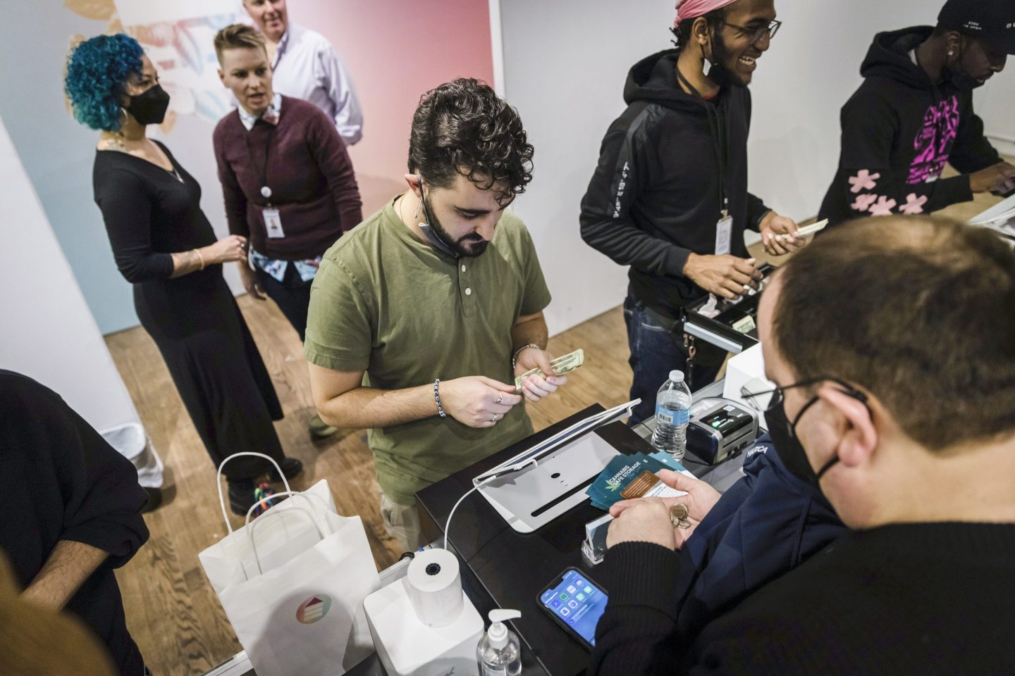 A customer, right, purchases cannabis products at the Housing Works Cannabis Co., New York's first legal cannabis dispensary, Thursday, Dec. 29, 2022, in New York.