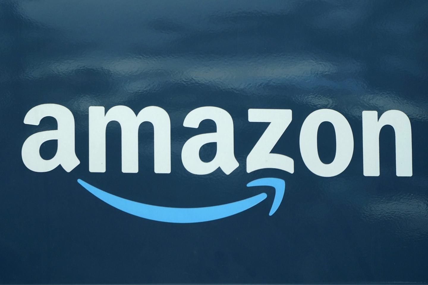 An Amazon logo appears on a delivery van, Oct. 1, 2020, in Boston. 