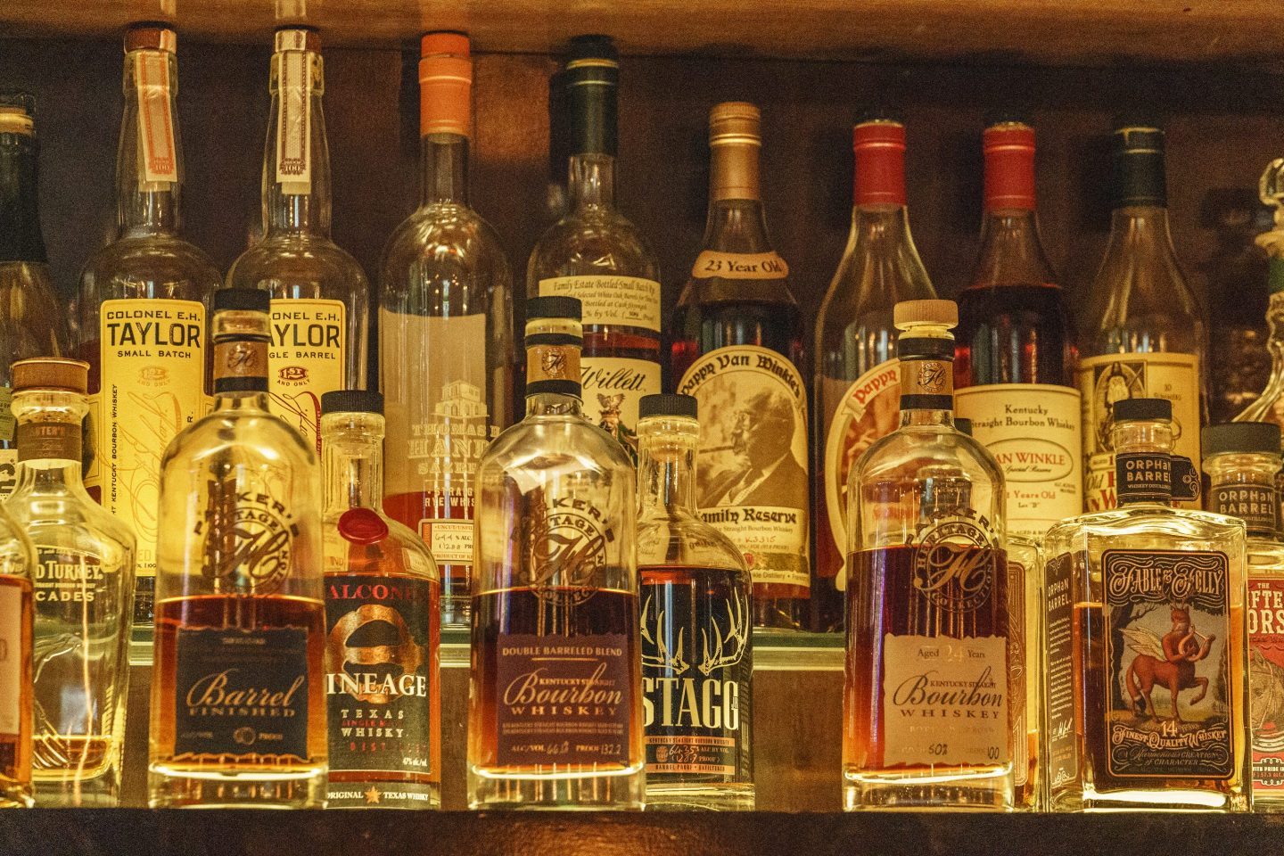 A collection of bottles of Pappy Van Winkle bourbons are seen on the top shelf right, among other fine whiskies at the "Far Bar," located in the historic Far East Building in the heart of Little Tokyo in Los Angeles on March 4, 2023.