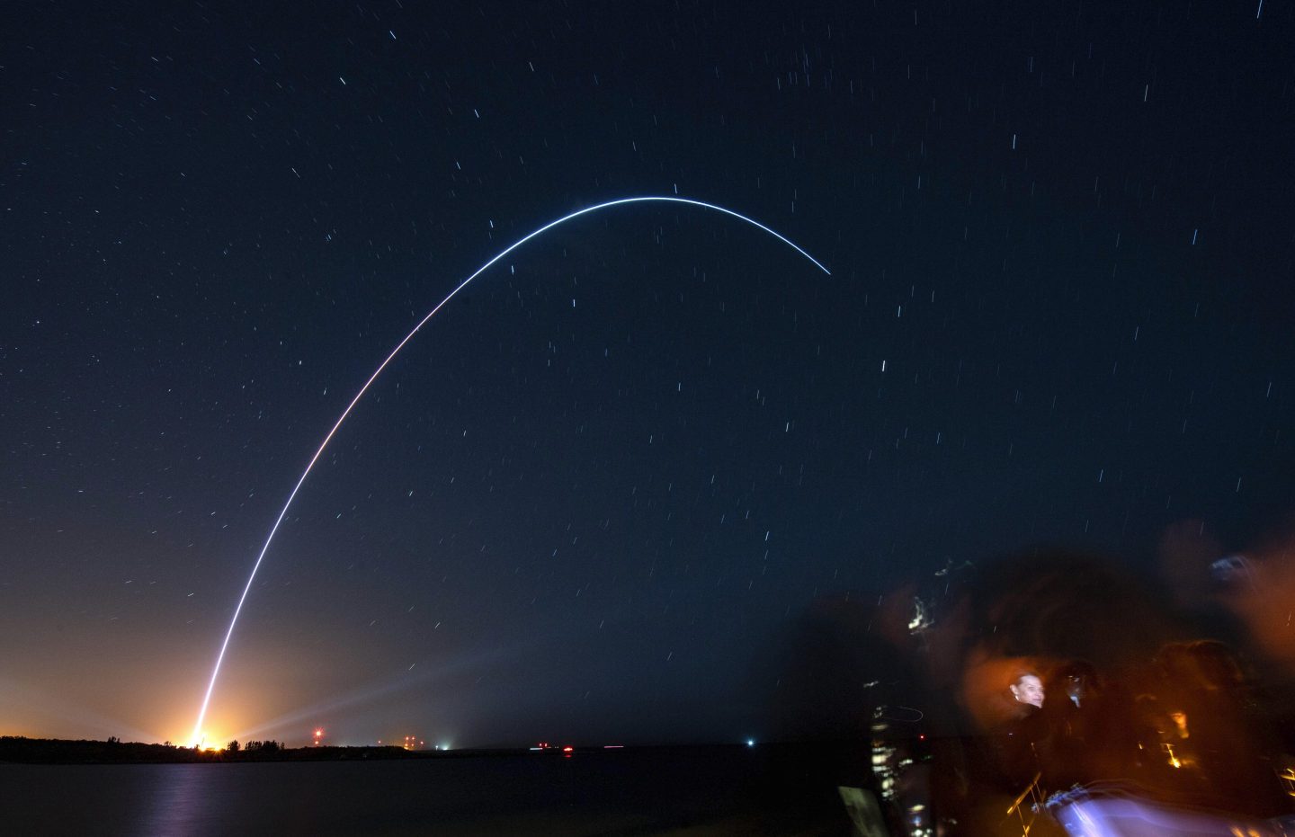 Spectators at Jetty Park in Cape Canaveral, Fla., watch as Terran I, a 3D-printed rocket by Relativity Space, lifts off from Cape Canaveral Space Force Station on March 22, 2023.