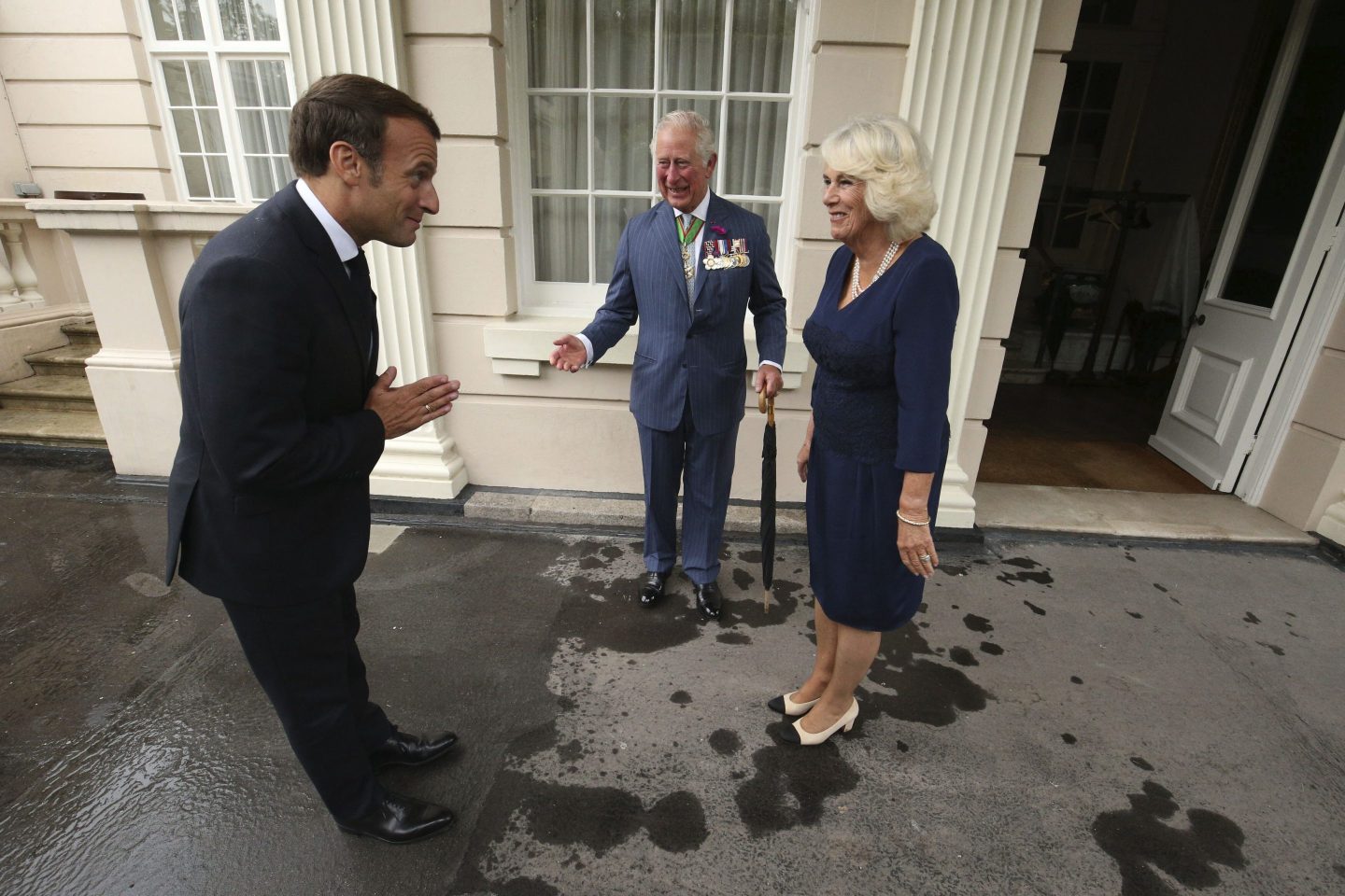 Britain's Prince Charles and Camilla, Duchess of Cornwall welcome French president Emmanuel Macron to Clarence House in London, Thursday June 18, 2020.