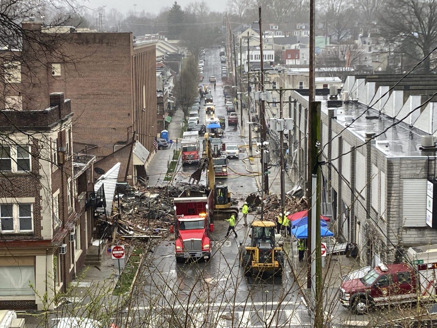 Emergency responders and heavy equipment are seen at the site of a deadly explosion at a chocolate factory in West Reading, Pa., on March 25.