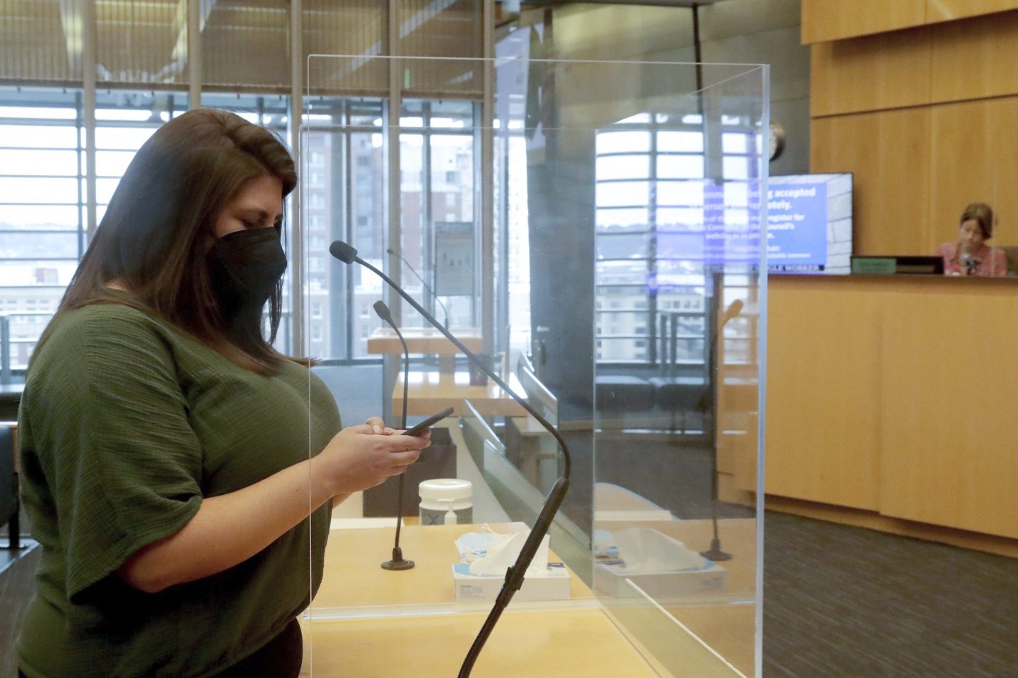 Gig worker Danielle Alvorado testifies before the Seattle City Council in support of the city providing permanent sick and safe time to most gig workers in the city, on March 28, 2023, in Seattle.