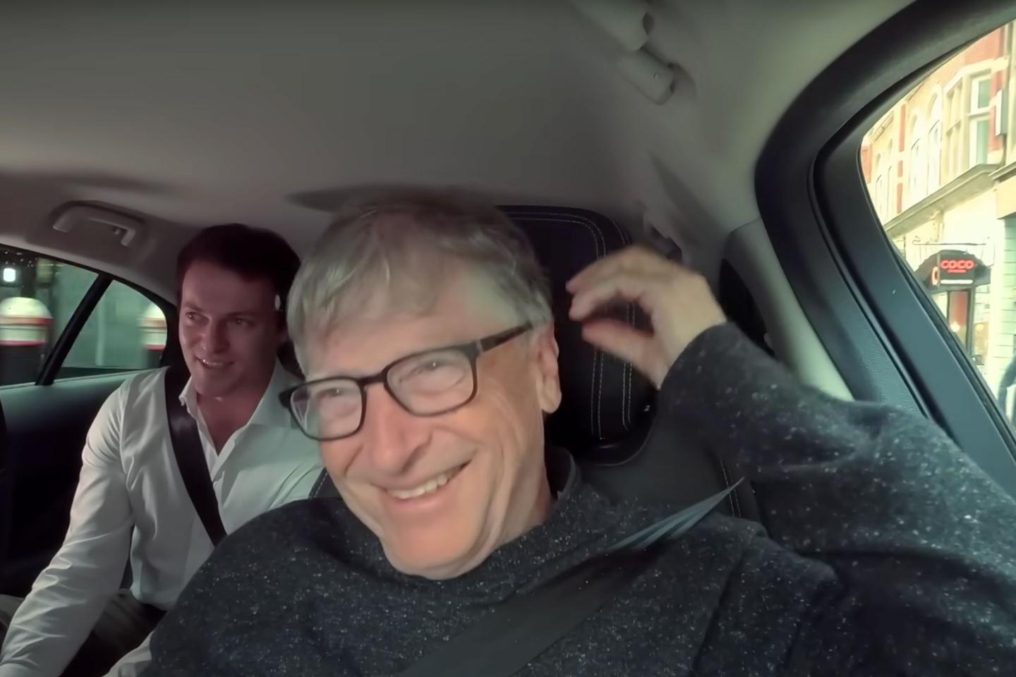 A still of Bill Gates in a car