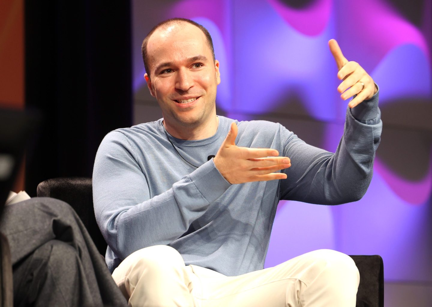 OpenAI President Greg Brockman speaking on stage at South by Southwest.