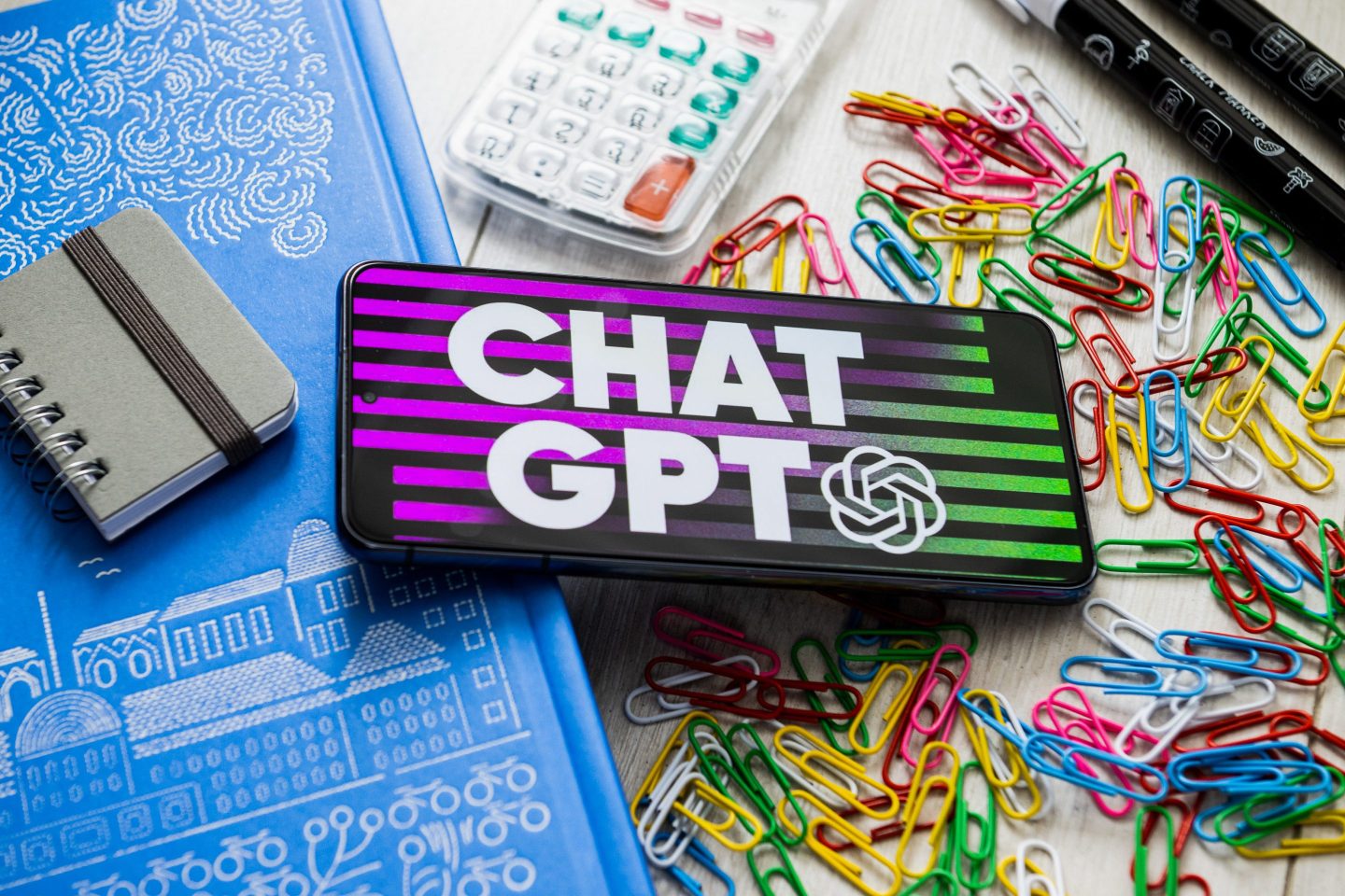 photo illustration with Chat GPT logo displayed on phone