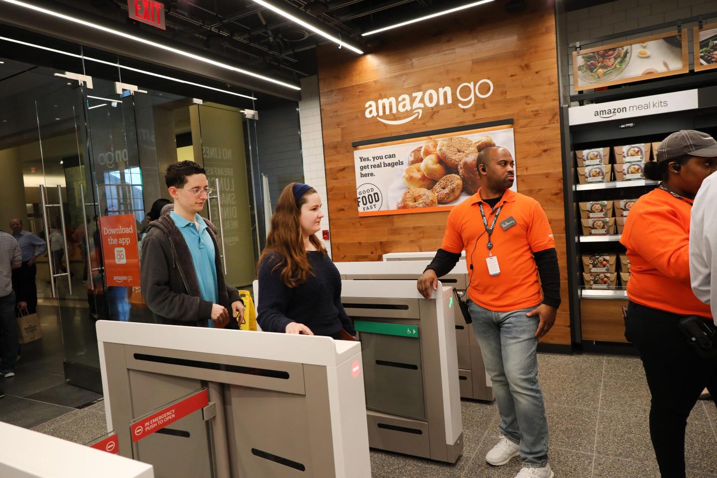 Customers shop at the cashier-less Amazon Go store on May 7, 2019 in New York City.
