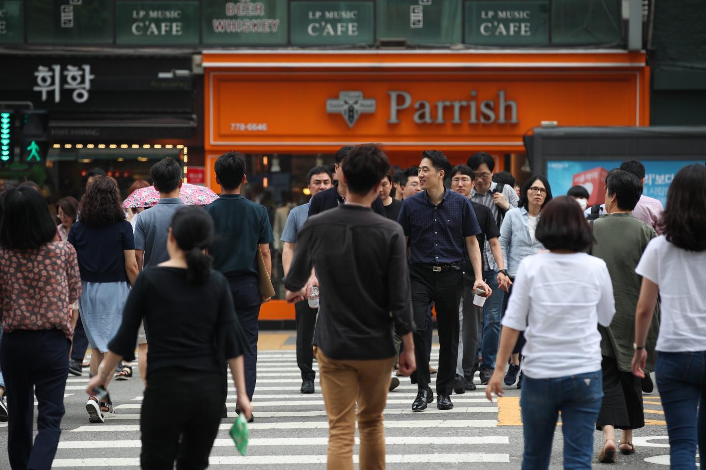 South Korean commuters crossing the street in 2019.
