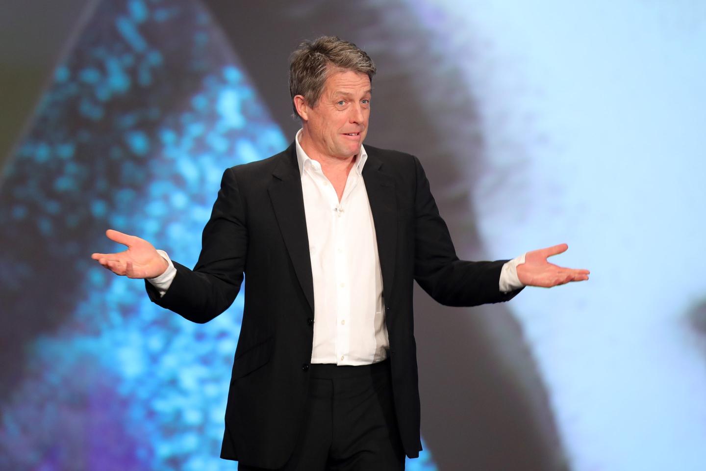 Hugh Grant speaking on stage