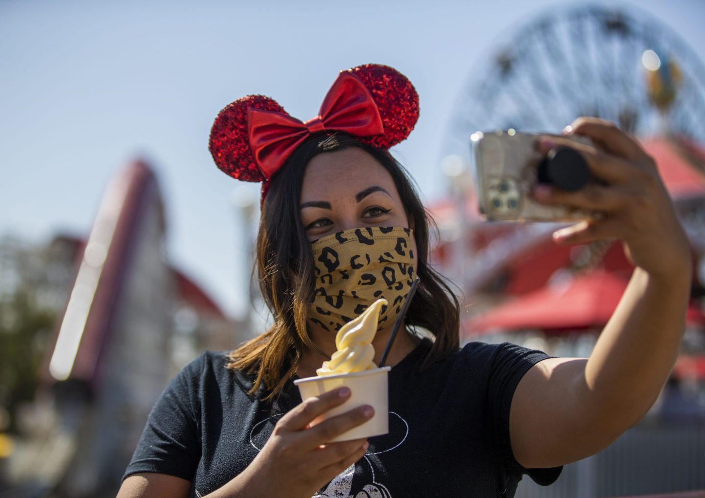 Disneyland visitor poses with a serving of Dole Whip