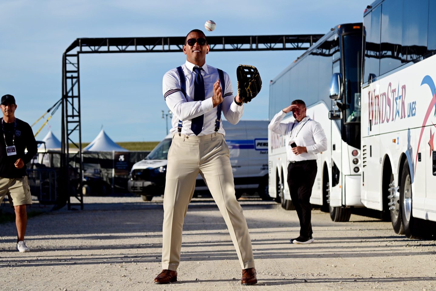 Alex Rodriguez plays catch in the parking lot during the game between the Chicago Cubs and the Cincinnati Reds at The MLB Field at Field of Dreams on Aug. 11, 2022 in Dyersville, Iowa.