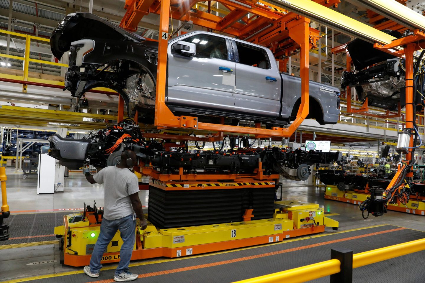 The truck cab is lowered on the frame of Ford Motor Co. battery powered F-150 Lightning trucks under production