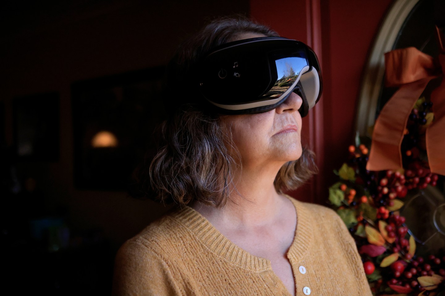 Donna Davis-Doneghy, who is battling symptoms from long COVID, displays displays a mask that she uses to help her fall asleep at her home in London, Ken., on Nov. 21, 2022. Factors like age, gender, BMI, and pre-existing conditions may put individuals at higher risk for long COVID, according to a new study.