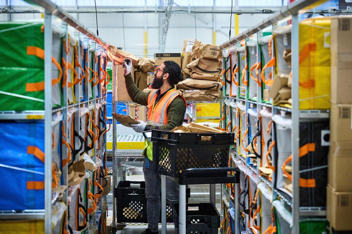 An employee works at an Amazon delivery station