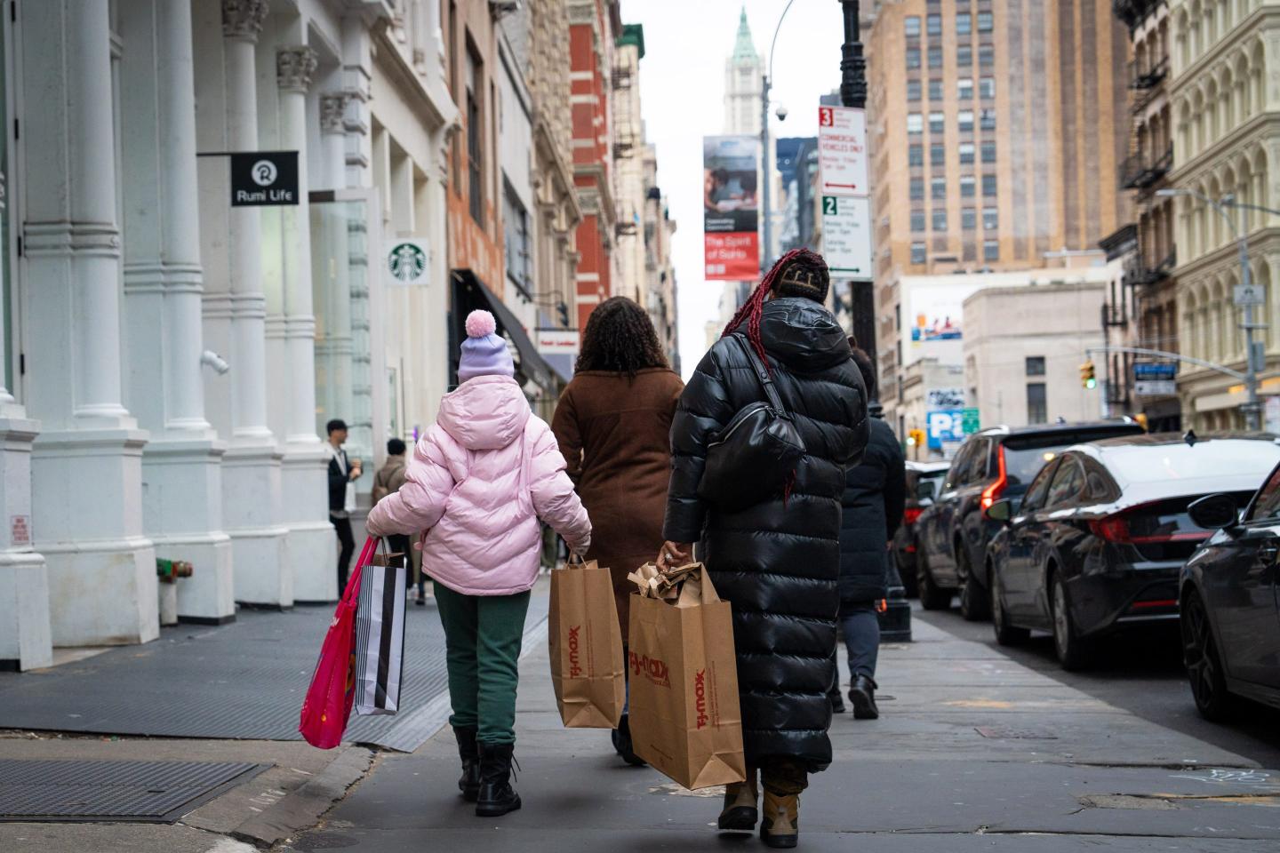 Shoppers carry bags in the SoHo neighborhood of New York Jan. 21, 2023.