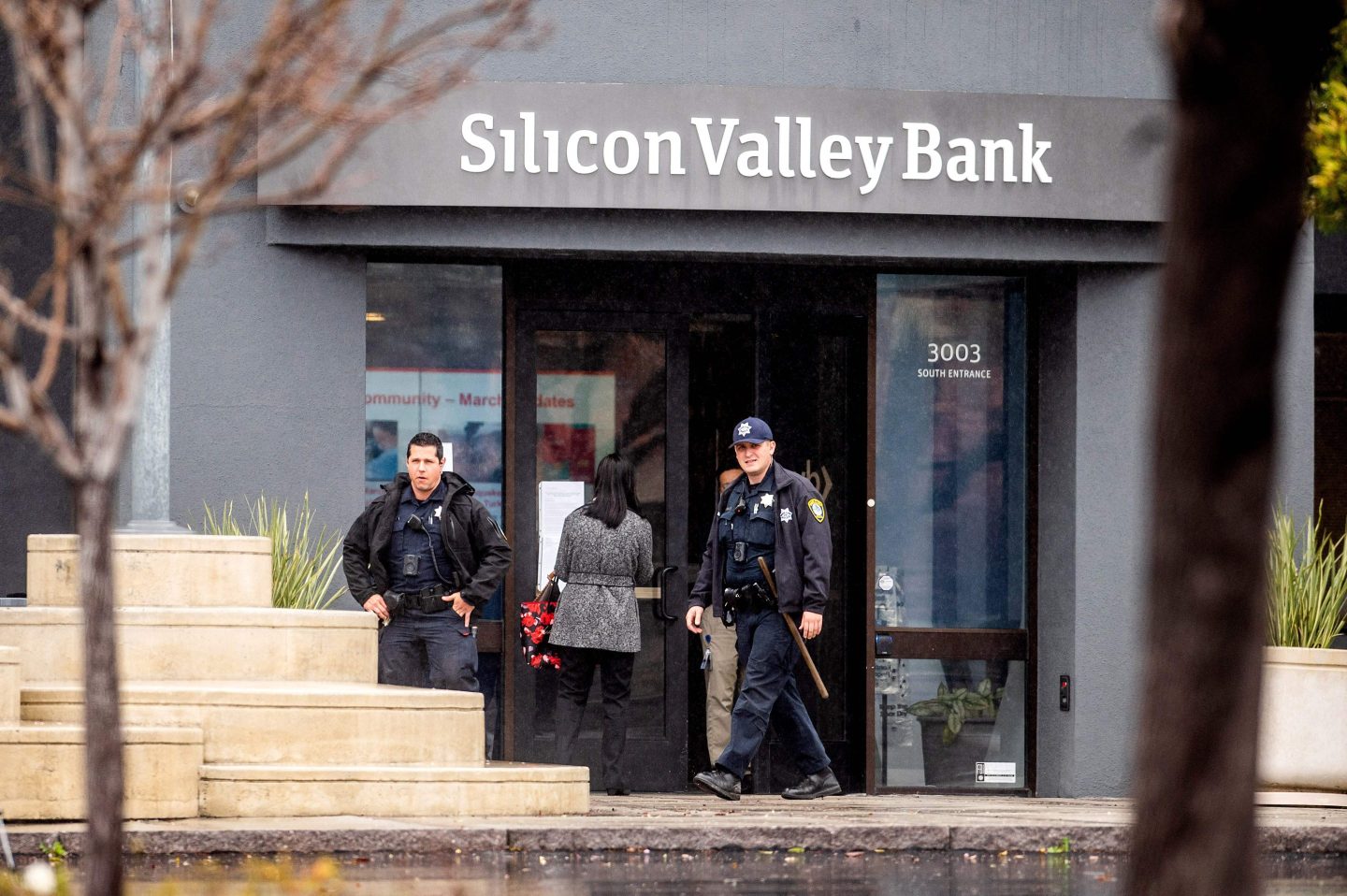 Police officers leave Silicon Valley Banks headquarters in Santa Clara, California on March 10, 2023.