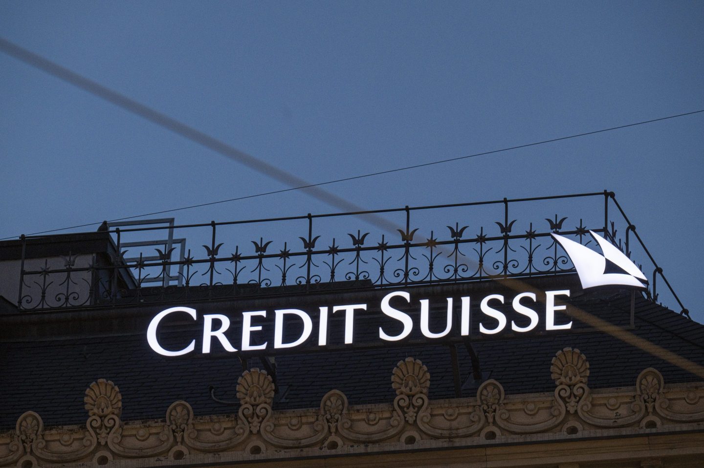 The logo of Credit Suisse on the bank's headquarters at night