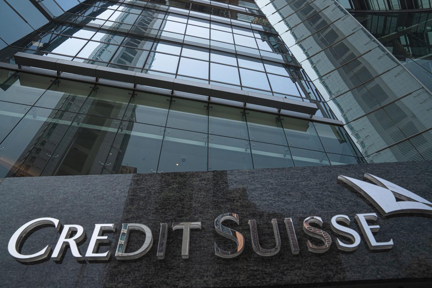 Signage for Credit Suisse Group AG outside a building.