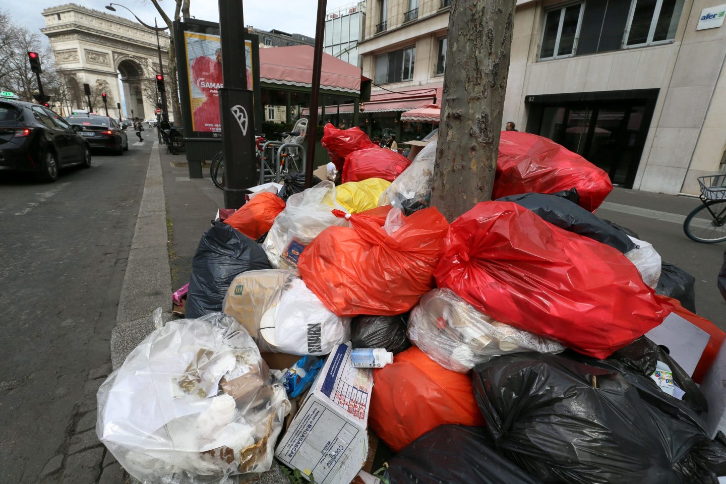 Garbage piled up on a Paris sidewalk.