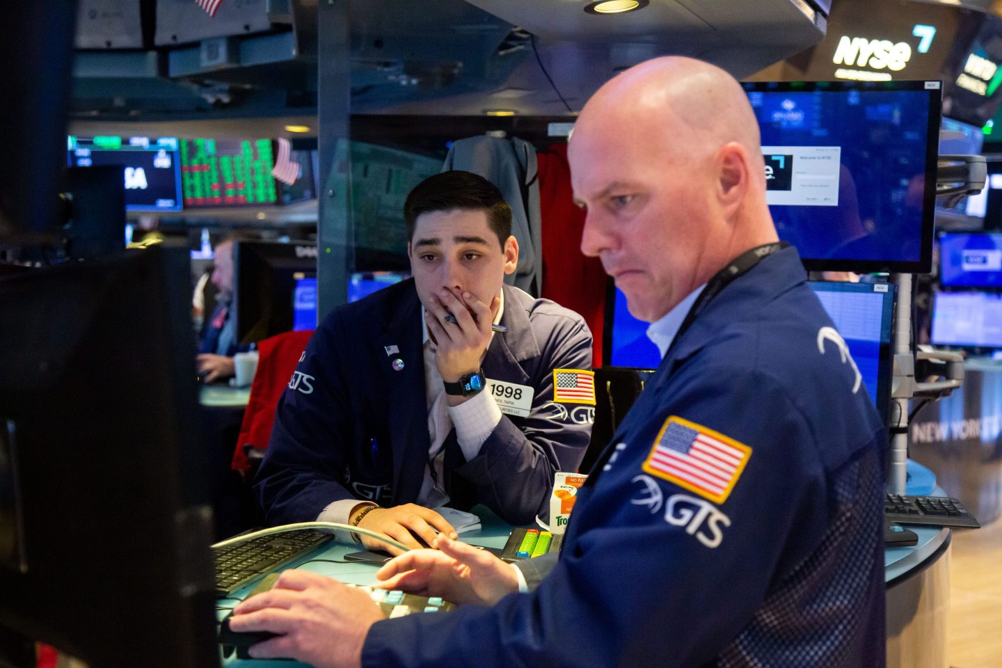 Traders work on the floor of the New York Stock Exchange (NYSE) in New York, US, on Monday, March 20, 2023.