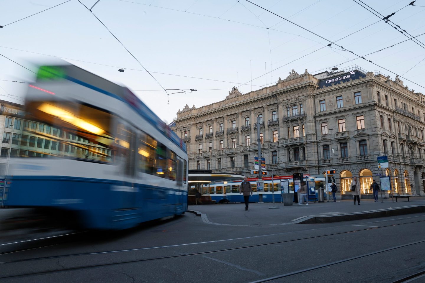 Trams travel past the Credit Suisse Group headquarters in Zurich, Switzerland, on March 21, 2023.