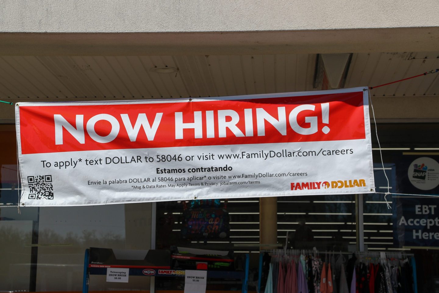 A large Now Hiring banner hung outside of a Family Dollar store in Pennsylvania