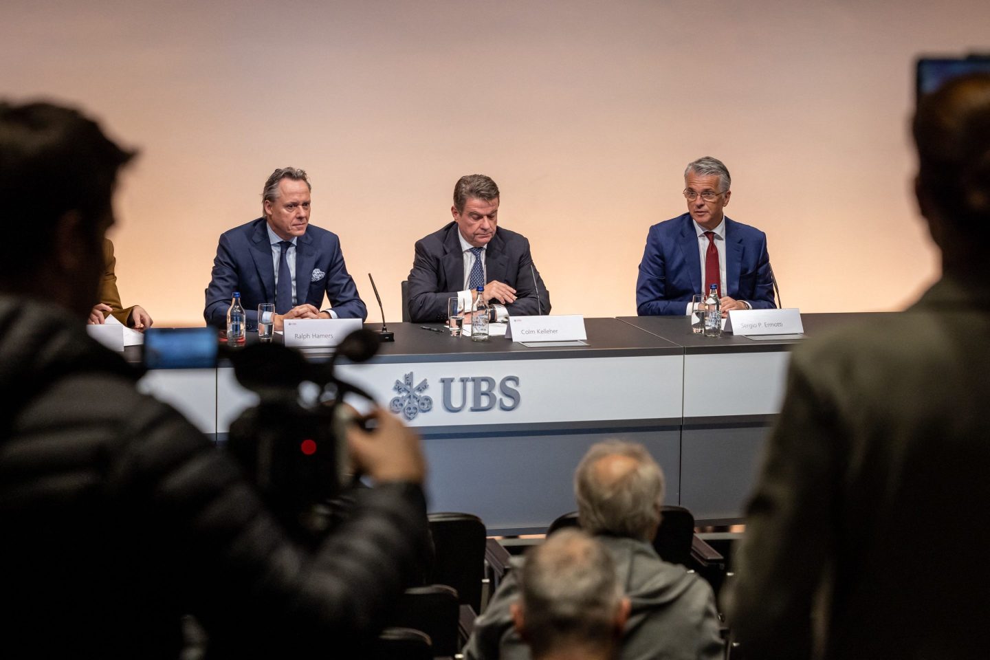Newly appointed UBS CEO Sergio Ermotti (right) speaks next to UBS Chairman Colm Kelleher (center) and outgoing CEO Ralph Hamers during a press conference in Zurich on Mar. 29.