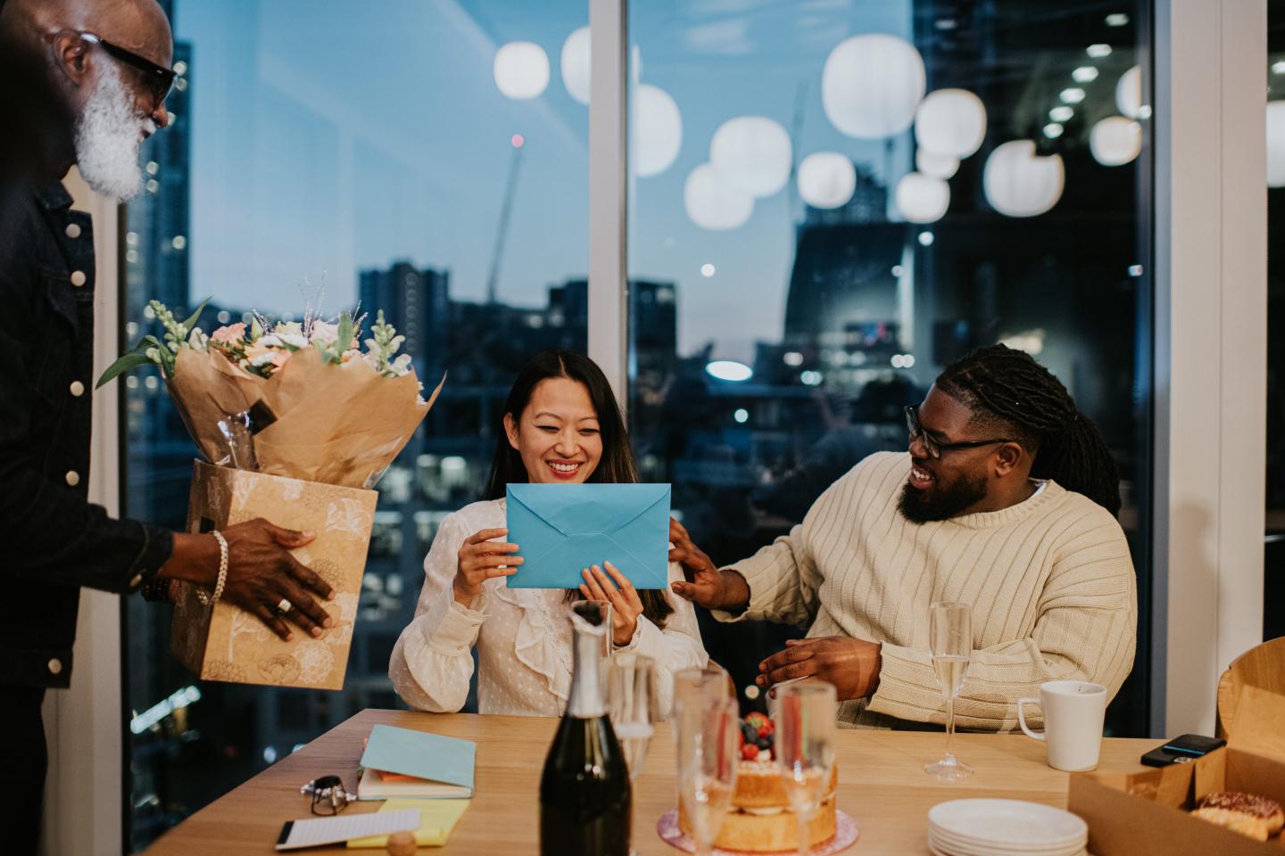 Office workers celebrate a colleague