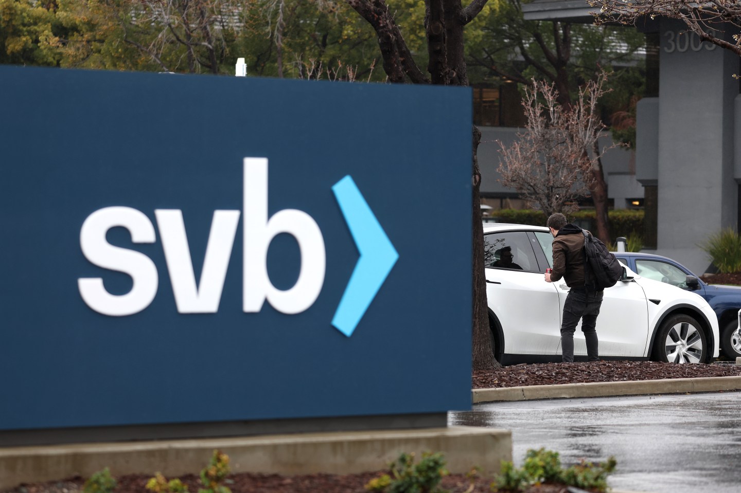 An employee gets into his car after arriving to work to a shuttered Silicon Valley Bank (SVB) headquarters on March 10, 2023 in Santa Clara, California.