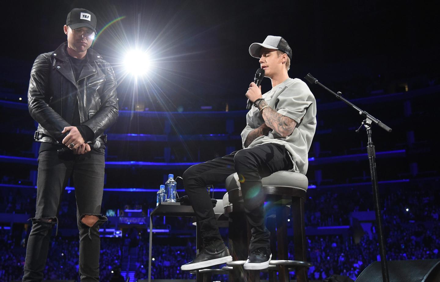 A church that counts Justin Bieber and Russell Wilson as members is accused of requiring employees to donate part of earnings as a tithe