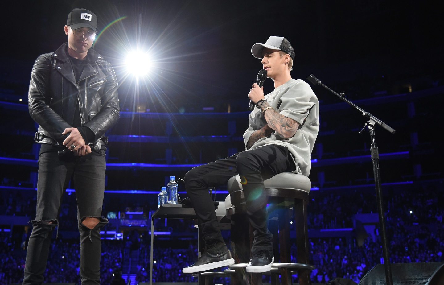 Pastor Judah Smith (L) and singer/songwriter Justin Bieber speak onstage at An Evening With Justin Bieber at Staples Center on November 13, 2015 in Los Angeles, California.